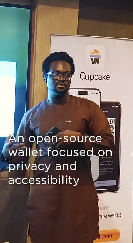 David presenting beside the Cupcake roll-up banner at the Cake Wallet workshop in Ouagadougou.