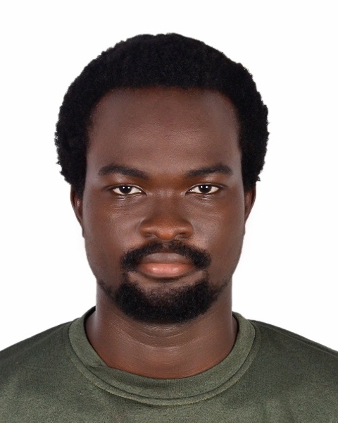 Studio portrait of David Adegoke against a white background.